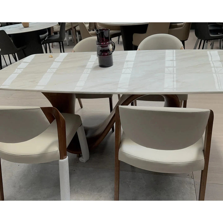 Front view of customised solid wood marble dining table highlighting smooth marble tabletop