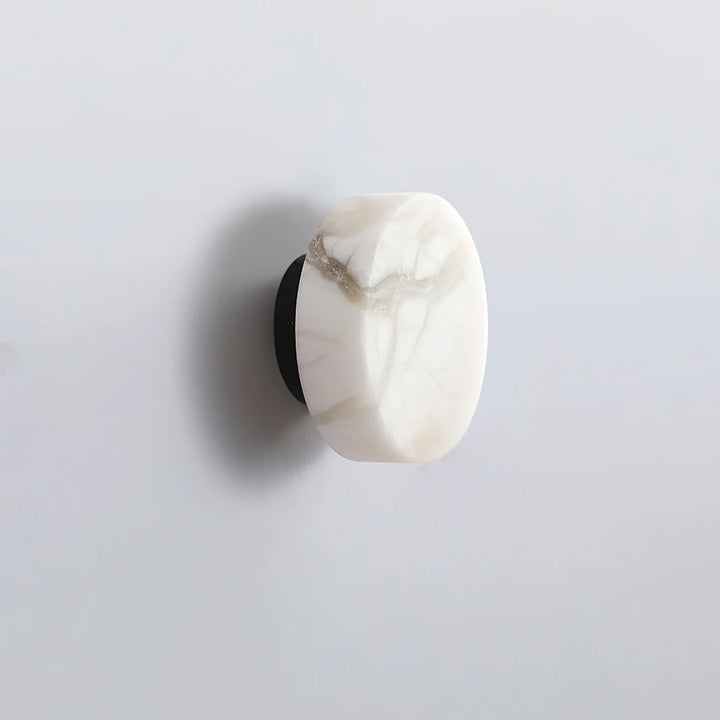 Side view of cylindrical alabaster wall light for modern and elegant home lighting décor