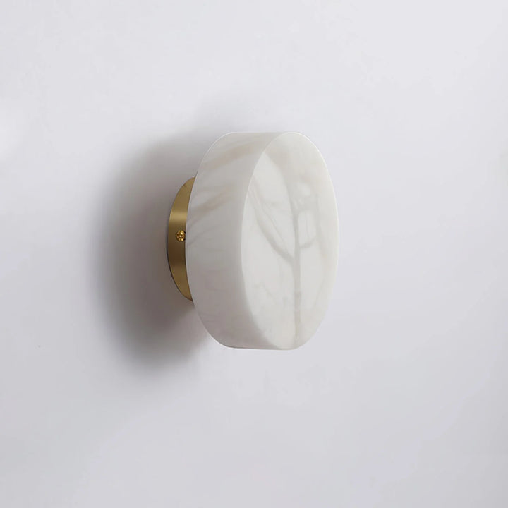 Side detail view of cylindrical alabaster wall light for elegant modern home décor