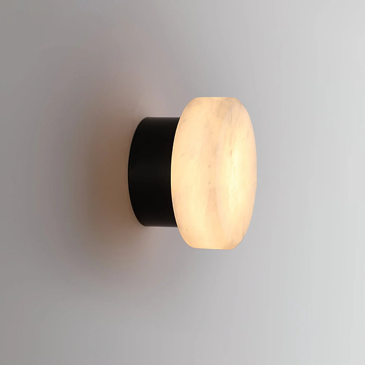Side view of cylindrical alabaster wall light for modern and stylish home lighting décor