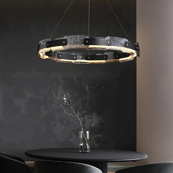 Dazzle single-tier chandelier light hanging above dining table, adding elegant sparkle and refined ambiance