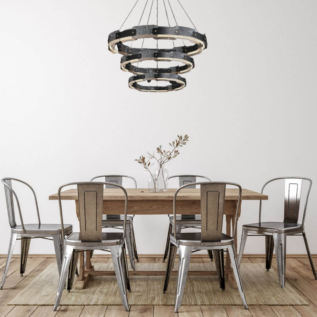 Dazzle three-tier chandelier light hanging above dining table, adding luxurious sparkle and sophisticated ambiance