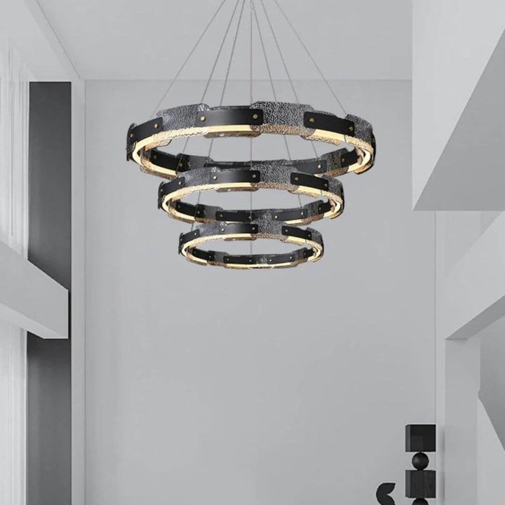 Dazzle three-tier chandelier light turned on in luxury living room, creating a stunning and elegant focal point with sparkling crystals