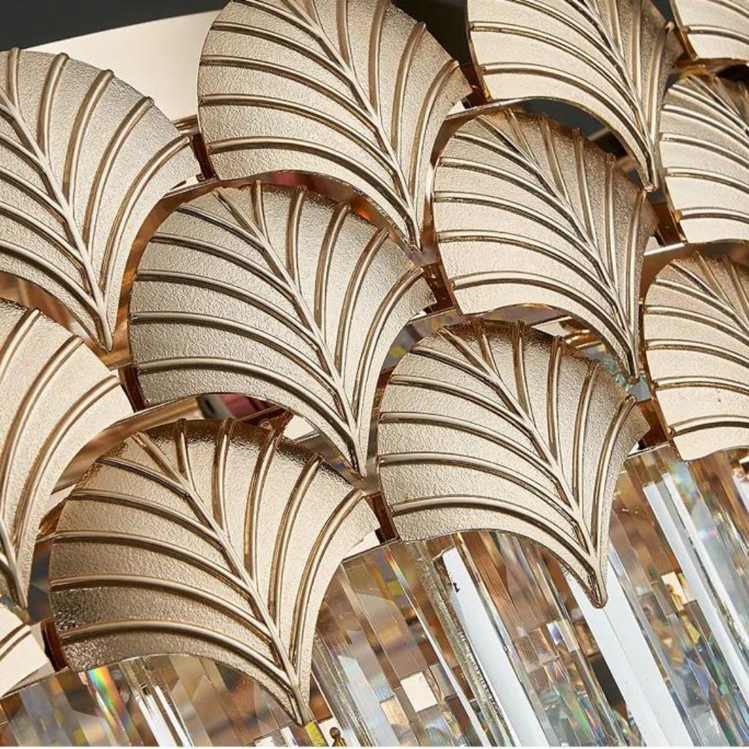 Close-up detail view of dazzling crystal chandelier light featuring intricate leaf-shaped crystal accents