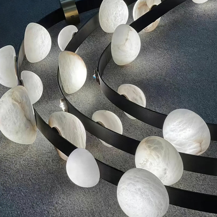 Front view of three-layer Dew Drops Alabaster chandelier in modern interior