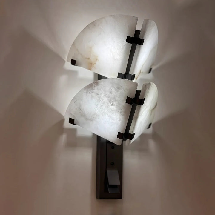 Dione alabaster wall light side view, elegant marble design for modern home interior lighting