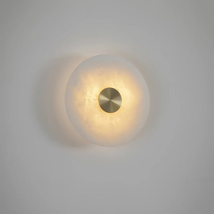 Disc-shaped alabaster wall light lamp, side view, elegant modern interior home lighting decor