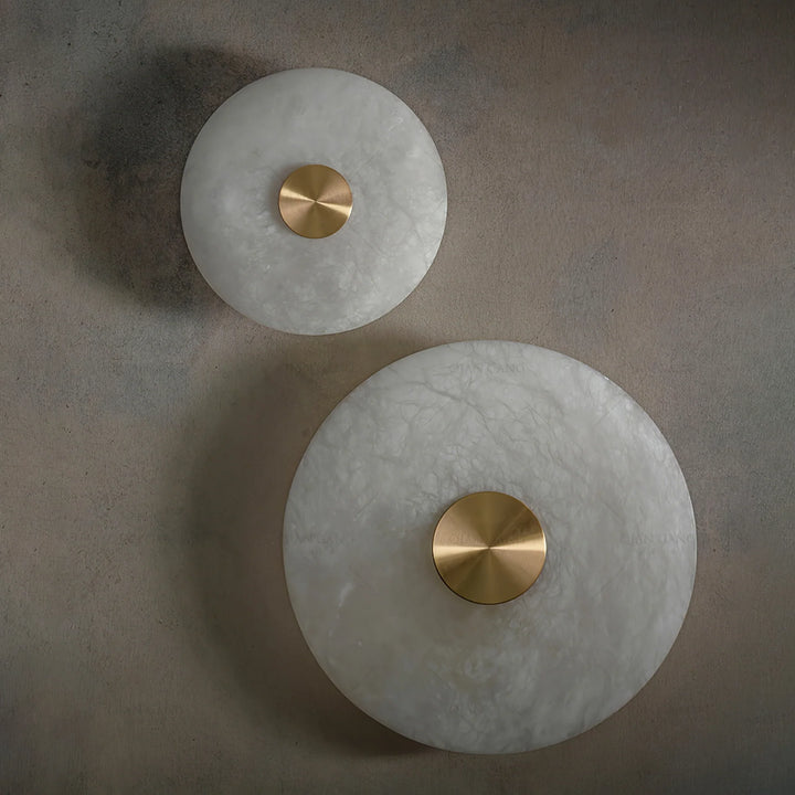 Disc-shaped alabaster wall light, front view, elegant modern interior wall lighting decor