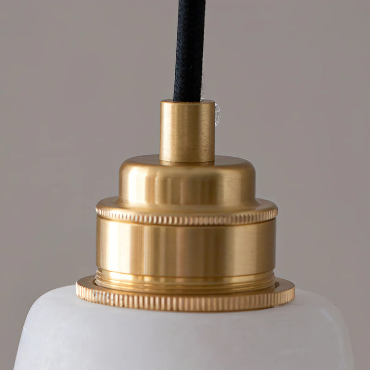 Droplet alabaster wall lamp with brass fitting and black fabric braided electrical cord