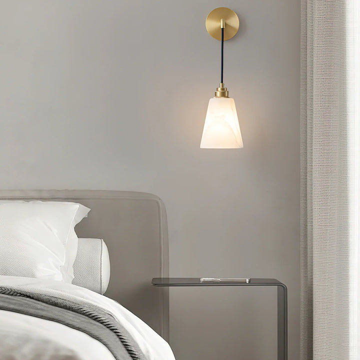 Droplet alabaster wall lamp used as a bedside lamp for elegant bedroom lighting décor