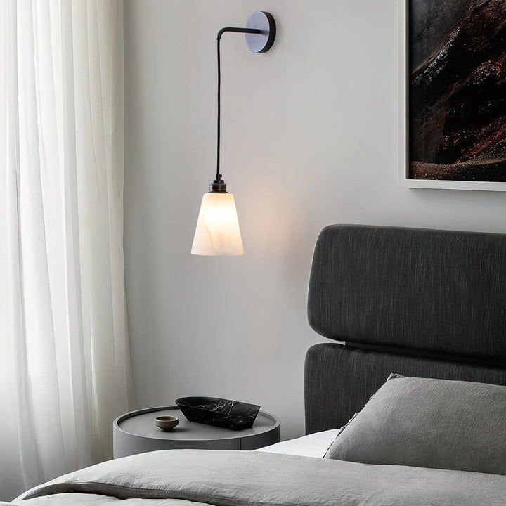 Bedside view of droplet alabaster wall lamp for modern bedroom lighting and décor