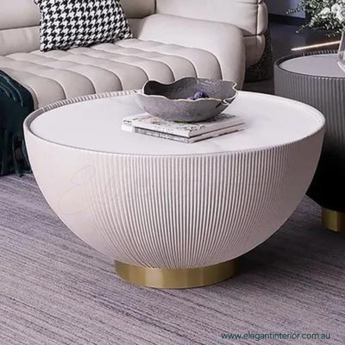 Drum coffee table with sintered stone top in elegant Australian interior, modern round design