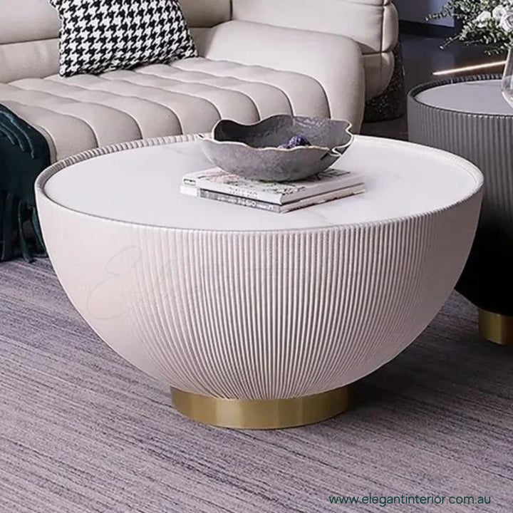Side view of Round Drum coffee table with sintered stone top and modern minimalist design
