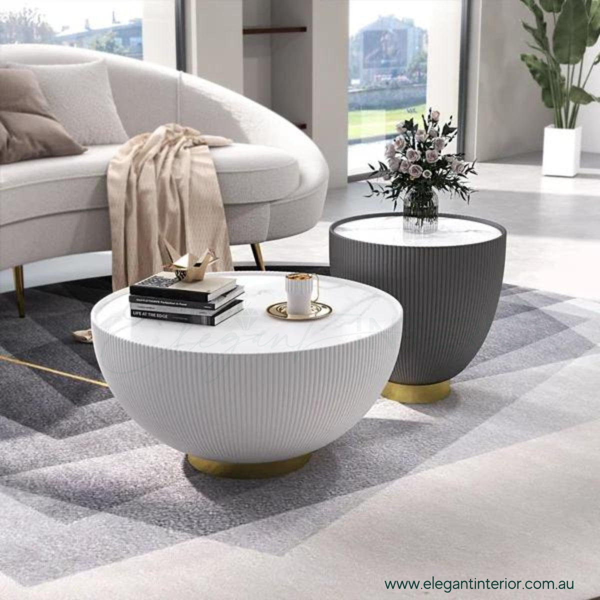 Drum coffee table with sintered stone top in living room featuring elegant Australian interior