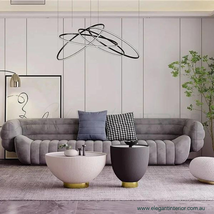 Round Drum coffee table with sintered stone top placed in front of living room setup