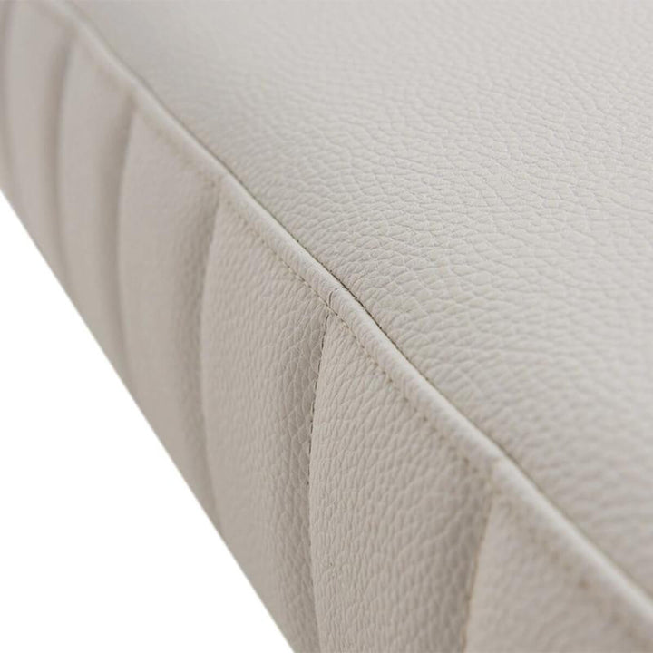 Close-up detail view of elegant cotton linen bedroom bench highlighting fine fabric texture and craftsmanship