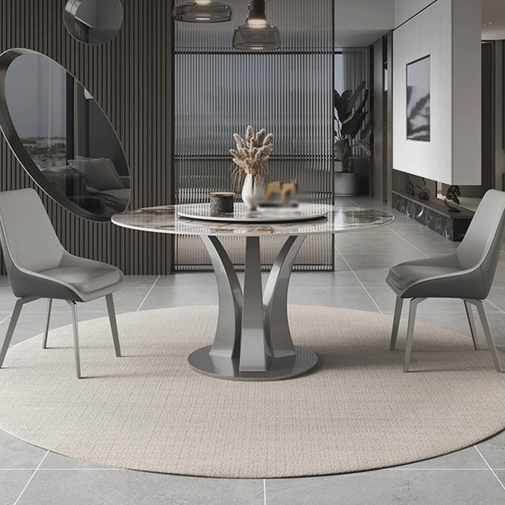 Custom-made round dining table with elegant design, featuring smooth metal finish, perfect for sophisticated interior settings
