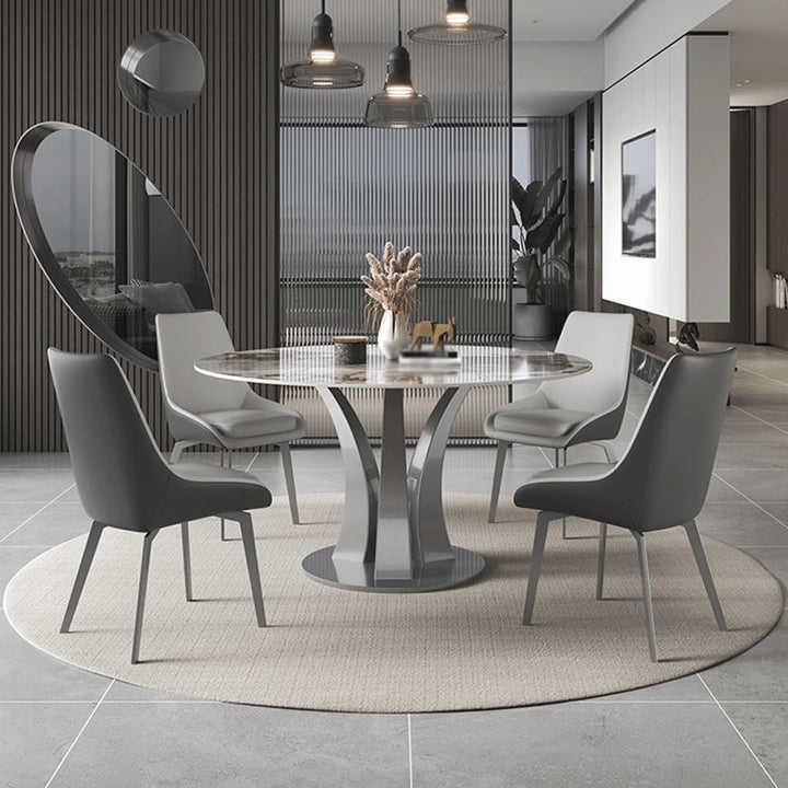 Custom-made round dining table with elegant design, featuring smooth metal finish, perfect for sophisticated interior settings