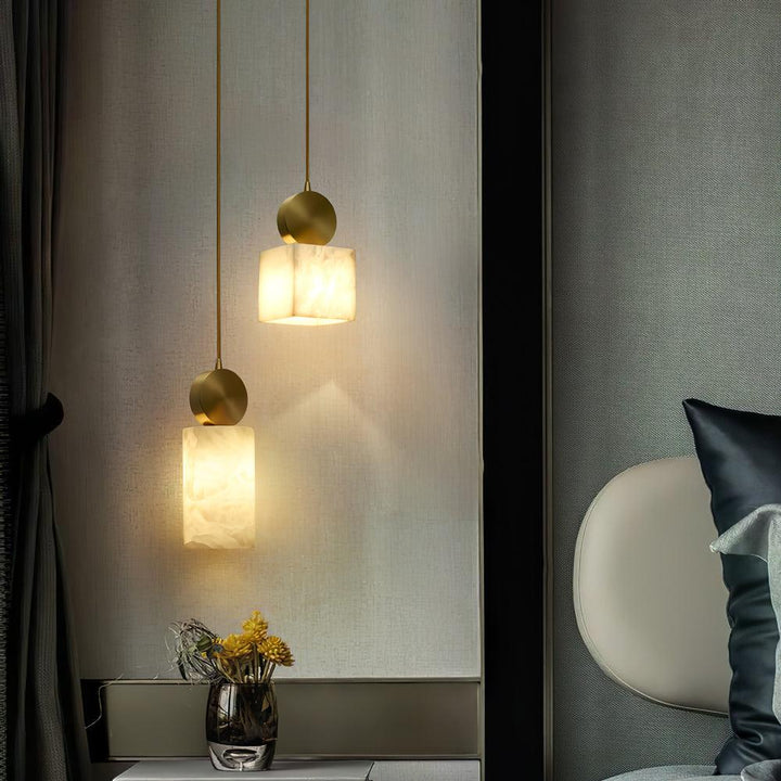 Etruscan alabaster pendant light with marble finish, elegant bedside interior view