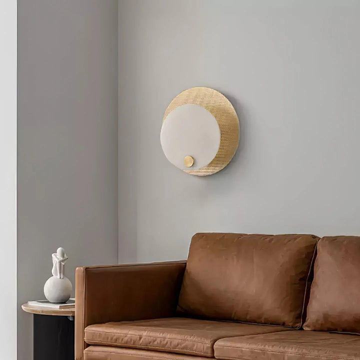 Evelyn alabaster wall sconce side view in living room, elegant marble design for modern interiors