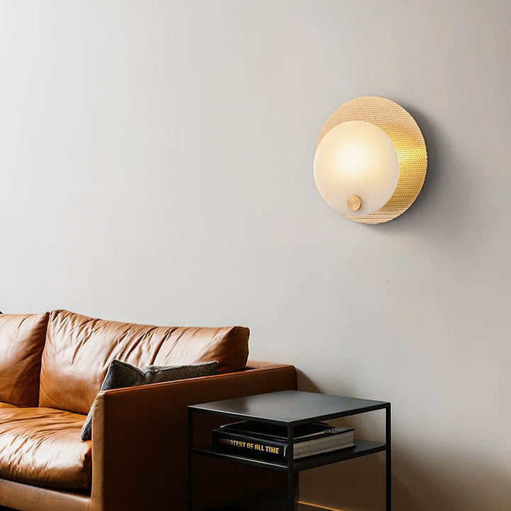 Evelyn alabaster wall sconce side view on living room back wall, elegant marble design for interiors