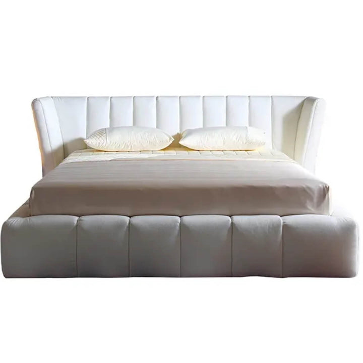 Front view of Ferrara bed highlighting plush upholstered headboard and sleek frame design