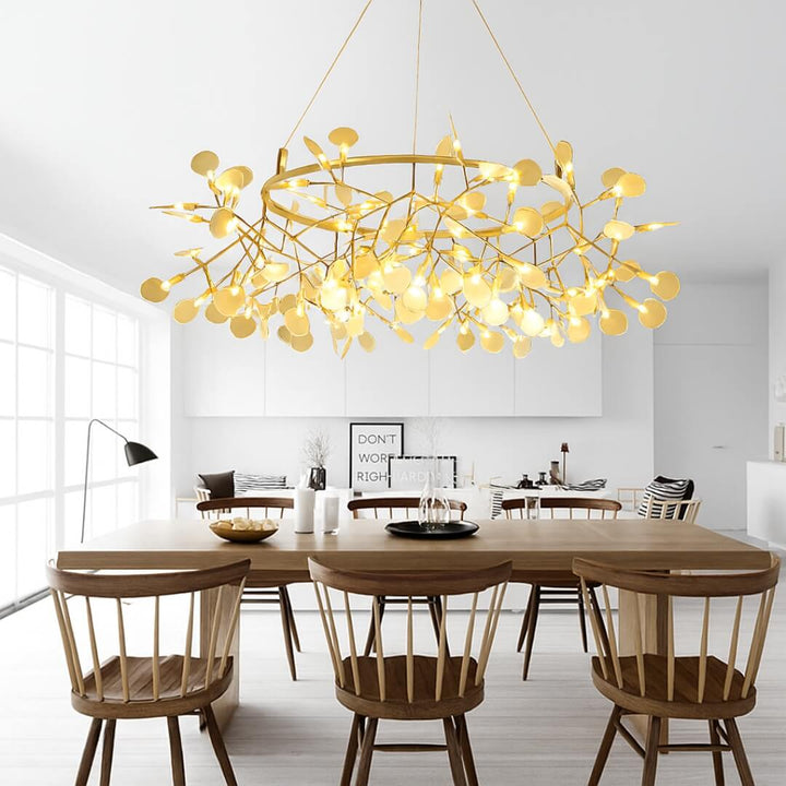 Firefly light chandelier in brushed gold, perfect for adding elegance to your living room ceiling.