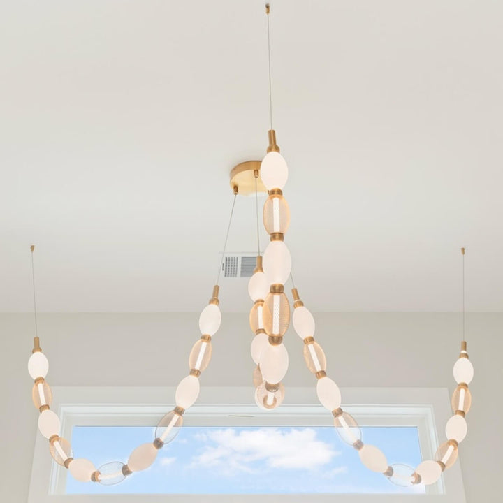 Florent 3-lamp adjustable LED chandelier in aged gold – modern ceiling fixture with movable arms and warm lighting.