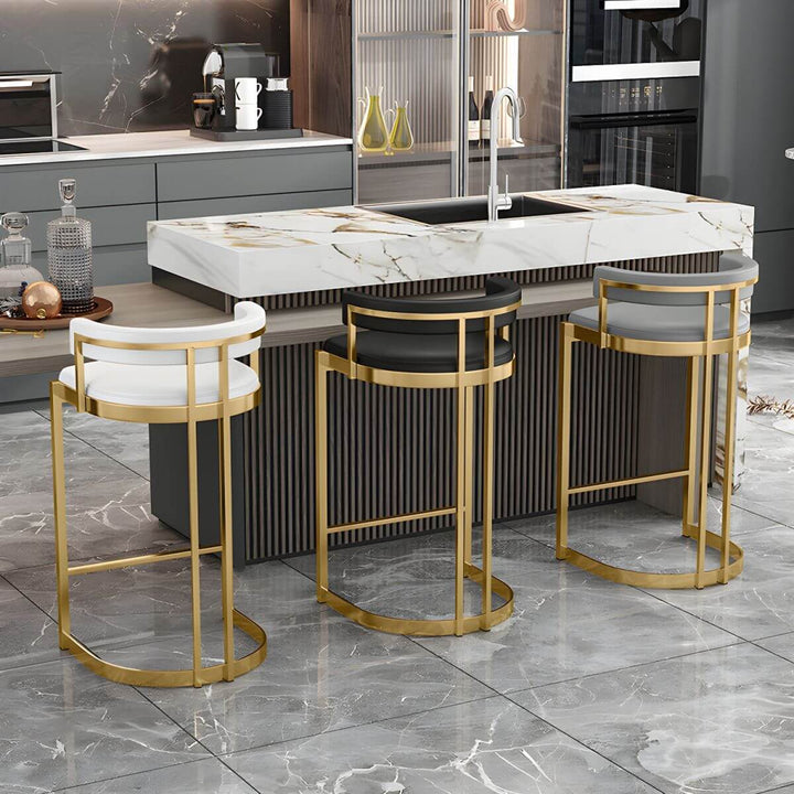 Glam bar stool back view – upholstered with gold base