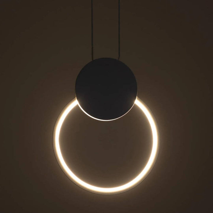 Gleam Circular Pendant Light turned on, emitting soft ambient illumination with a sleek, modern circular design perfect for contemporary interiors.