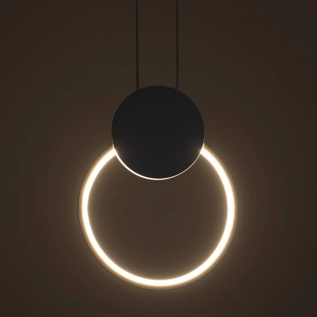 Gleam Circular Pendant Light turned on, emitting soft ambient illumination with a sleek, modern circular design perfect for contemporary interiors.