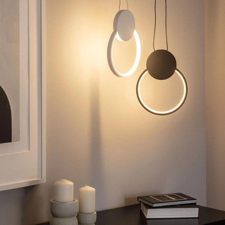 Gleam circular pendant light turned on in Australia, casting soft, ambient light with a modern and minimalist design