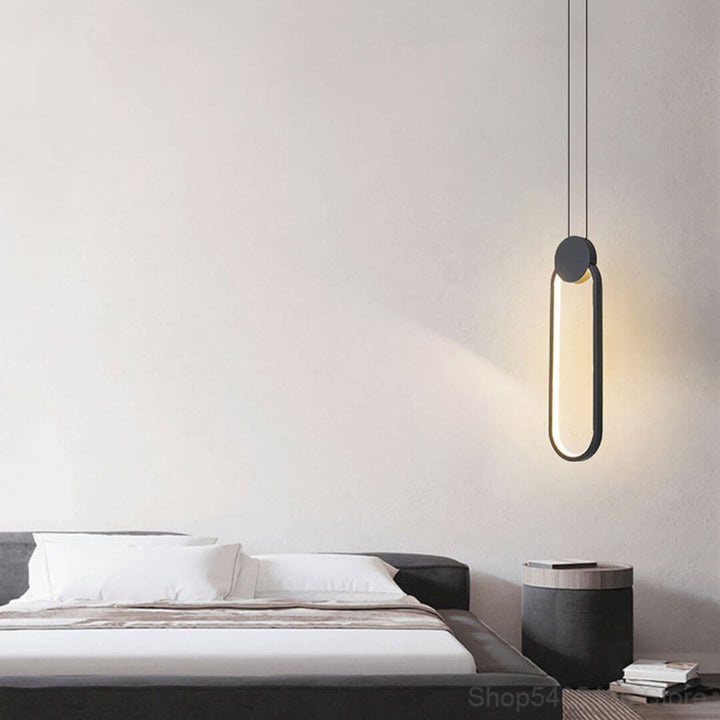 Glow Oval-Shaped Pendant Light Hanging Above Bedside Table – Contemporary Bedroom Light