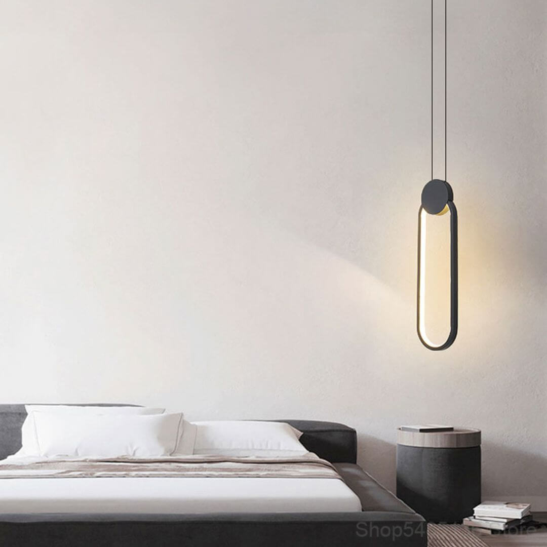 Glow Oval-Shaped Pendant Light Hanging Above Bedside Table – Contemporary Bedroom Light