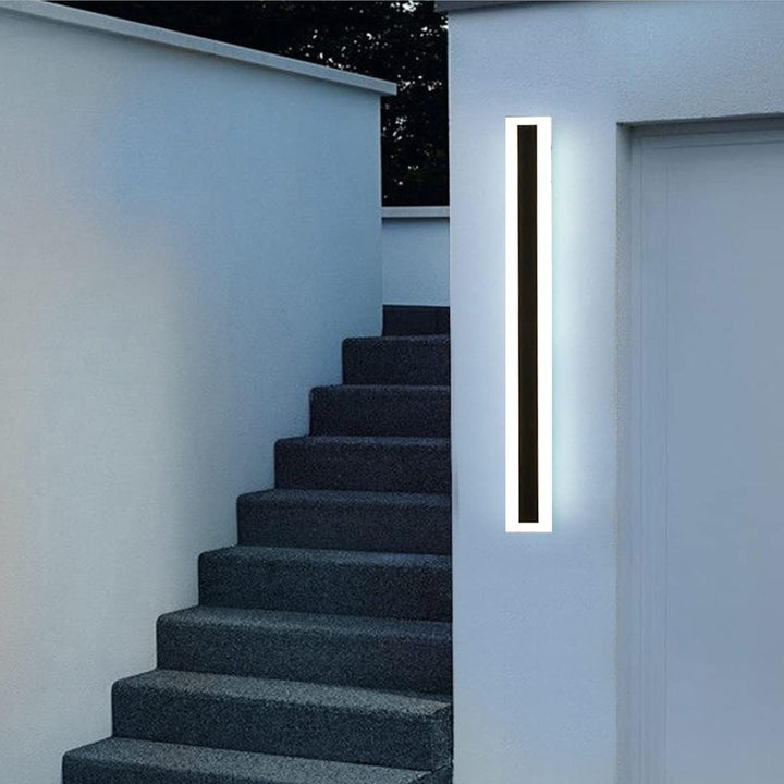 GlowEdge linear modern outdoor wall light installed beside stairway – sleek architectural lighting for enhanced safety and style.