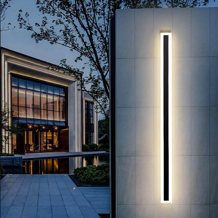 GlowEdge linear modern outdoor wall light installed at entry gate – minimalist design providing stylish and functional illumination.