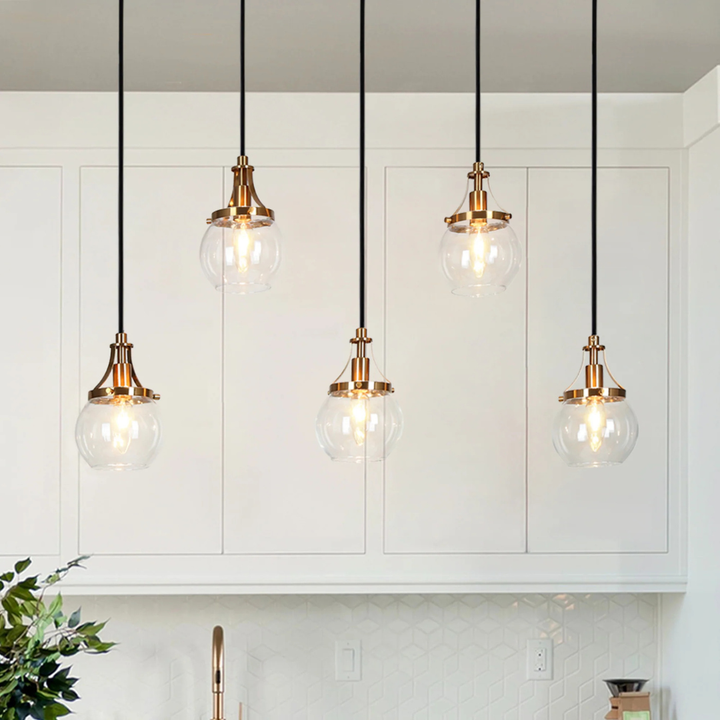 Close-up view of Goblet modern 5-light kitchen island lighting showcasing glass and metal details