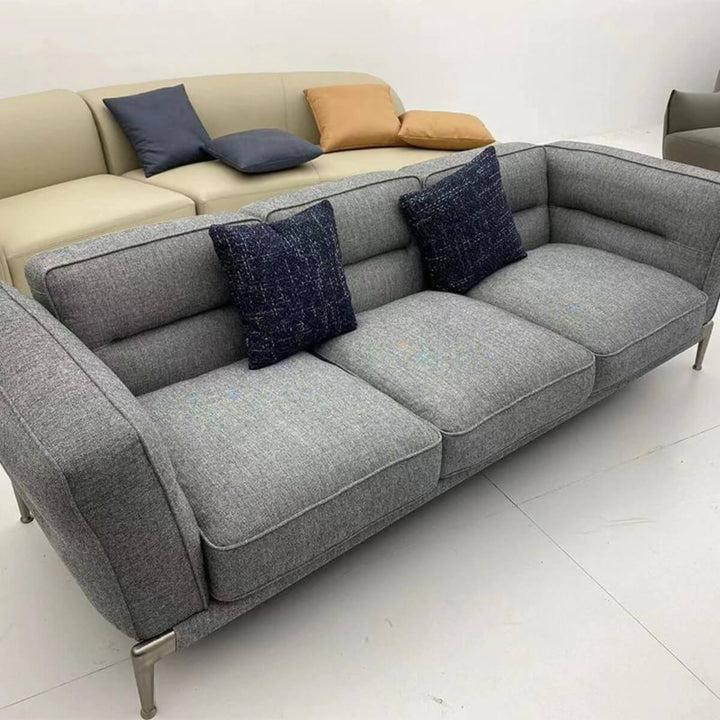 Angled view of Graceful Grandeur KS18 Ada sofa with cotton-linen upholstery – modern elegant design featuring plush cushions and sleek contours