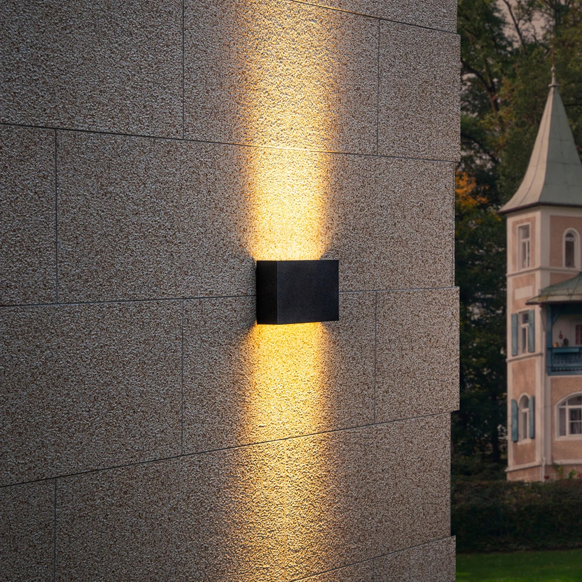 Side view of Graphite Glow LED Wall Light outdoors – Durable and stylish lighting for exterior spaces.