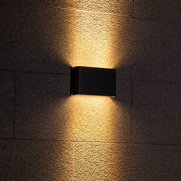 Graphite Glow LED Wall Light turned on – Bright and energy-efficient lighting for contemporary spaces.
