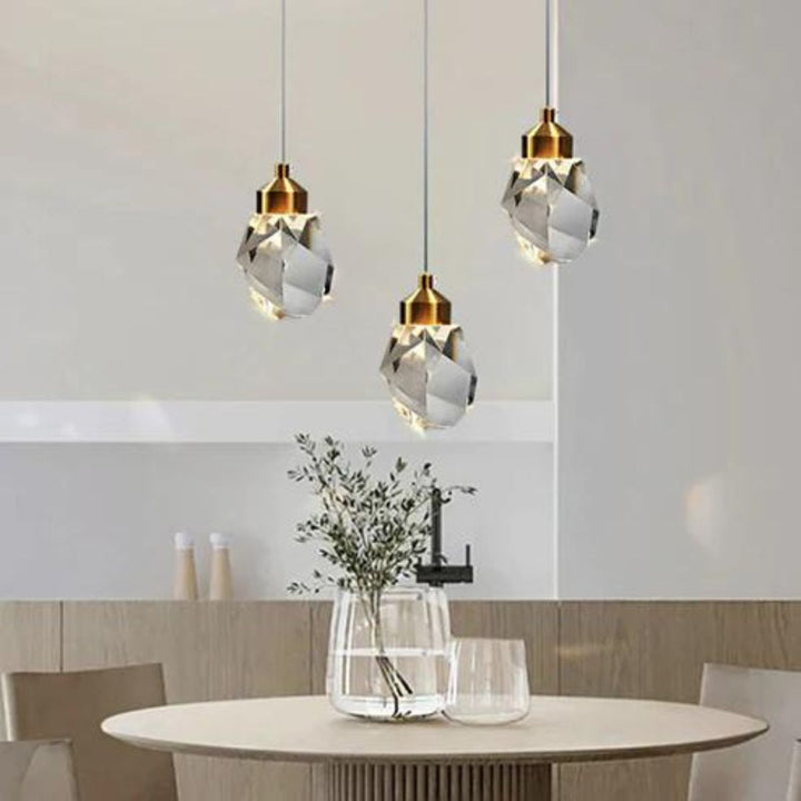 Harmony single-piece pendant light elegantly hanging above dining table, providing warm ambient lighting in a modern dining room