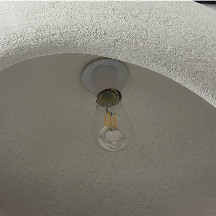 Inner view of Igloo 40 resin pendant light showing smooth resin interior and lighting fixture details.