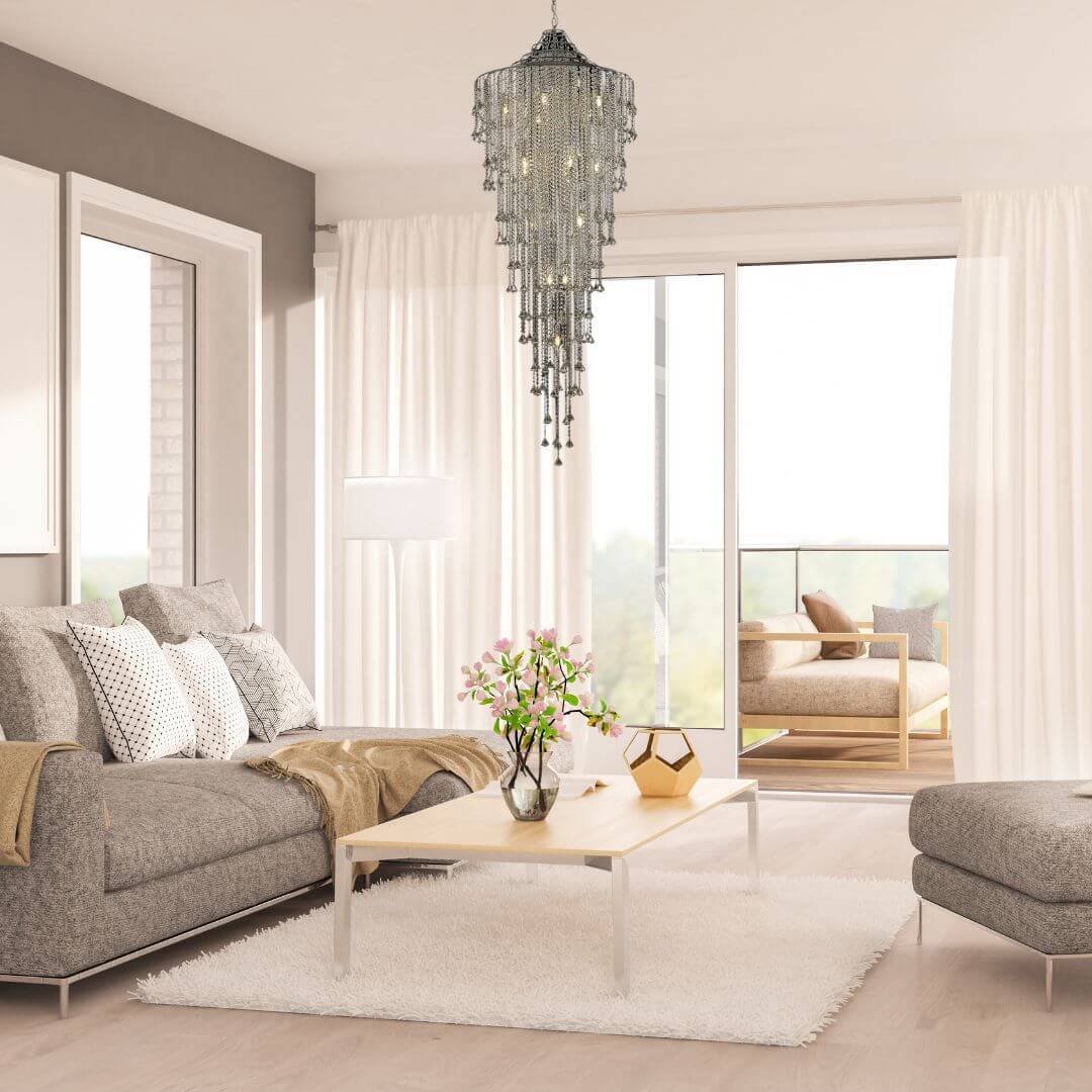 Illusion crystal chandelier hanging above staircase in living room, creating a stunning and elegant focal point