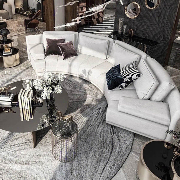 Top view of infinity curved leather sofa in elegant living room interior, featuring modern luxury design