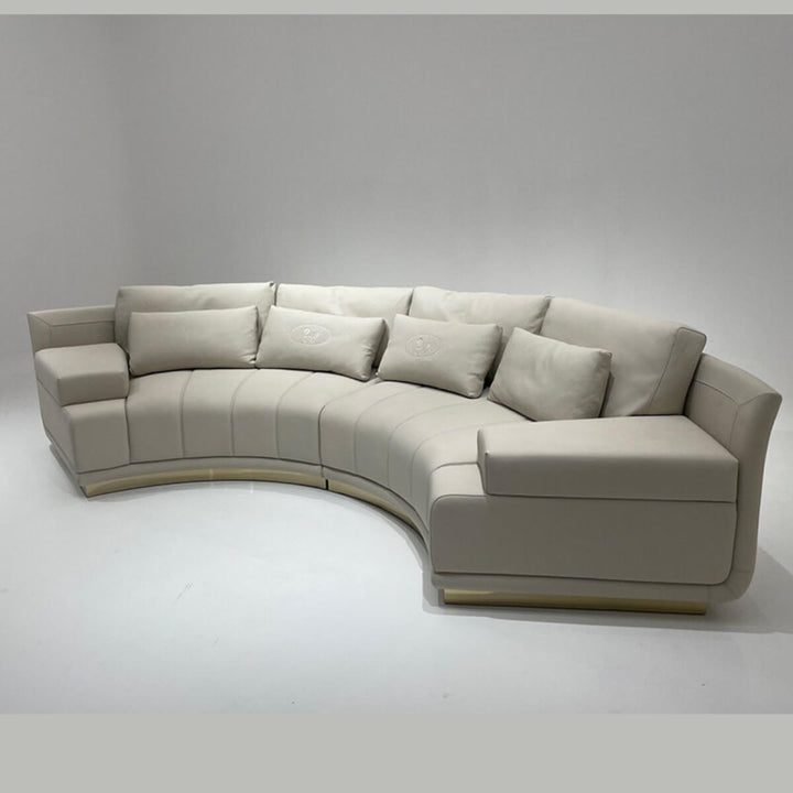 Side angle view of infinity curved leather sofa in elegant interior, highlighting sleek modern design