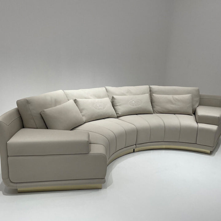 Side view of infinity curved leather sofa in elegant interior, showcasing contemporary luxury design