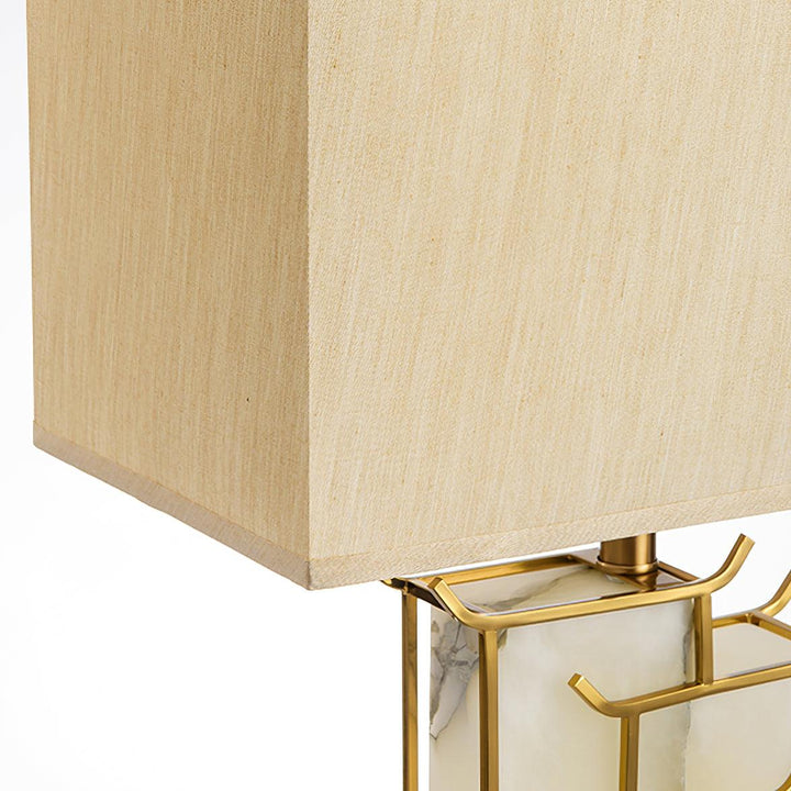 Front view of July table lamp, showcasing modern design with warm ambient lighting for stylish interiors
