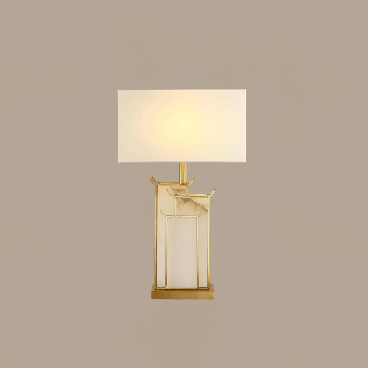 Front view of July table lamp, showcasing modern design with warm ambient lighting for stylish interiors