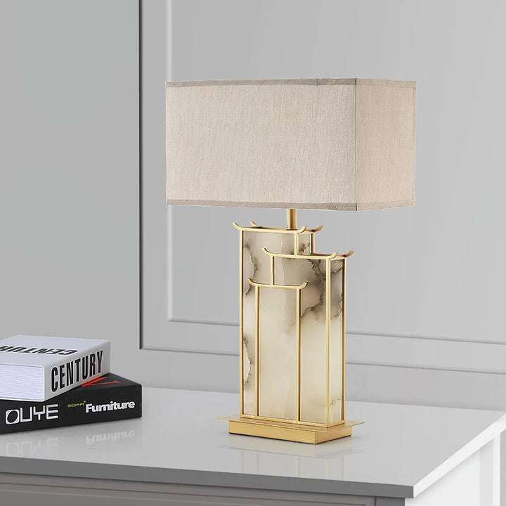 Side view of July table lamp, showcasing sleek modern design with warm ambient lighting for interiors