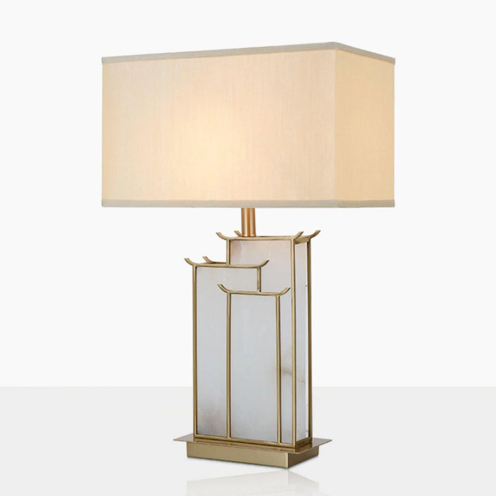 Modern July table lamp with sleek design and warm lighting, shown from front view.